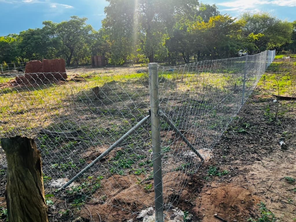 Chain link fence installation in progress